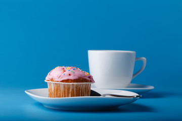 Colorful muffin on saucer