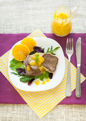 Boiled beef tongue with orange sauce