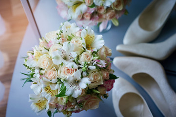 beautiful wedding bouquet and white shoes