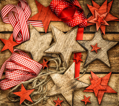 christmas decorations wooden stars and red ribbons