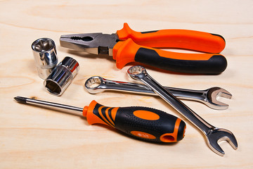 Metallic spanners on the wooden background