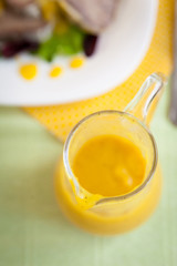 Sauceboat with orange sauce