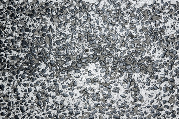 Grunge cracked white paint asphalt texture.