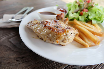 chicken steak on white dish.