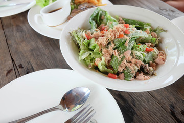 Tuna salad on white dish.