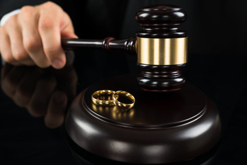 Close-up Of Judge Hitting Gavel With Rings