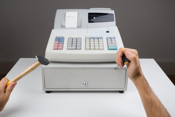 Person Hands With Worktool And Cash Register