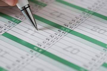 Person Writing An Important Event On Calendar