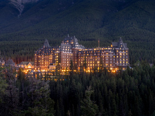 Night in Banff National Park with the Banff Springs Hotel in the distance.  - obrazy, fototapety, plakaty