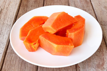 Papaya slice isolated on white background
