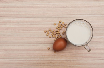 Obraz na płótnie Canvas top view of egg,soy beans and soy milk