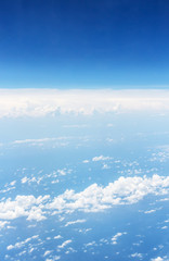 Naklejka na ściany i meble white clouds and blue sky, take a picture on the airplane