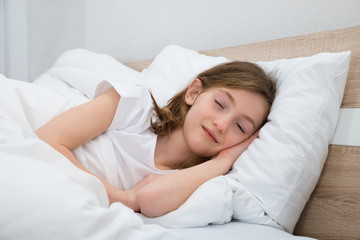 Obraz na płótnie Canvas Girl Sleeping In Bed
