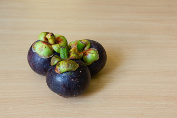 Mangosteens on table