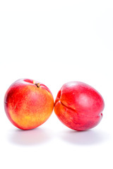 fresh peaches on white background