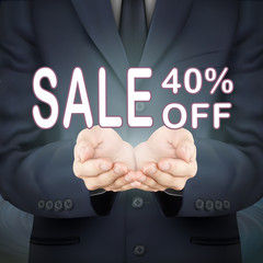 businessman holding sale 40 percent off words