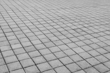 
Grey brick stone street road. Light sidewalk, pavement texture