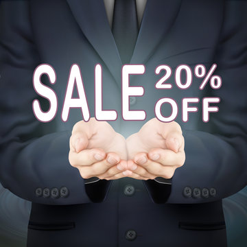 businessman holding sale 20 percent off words