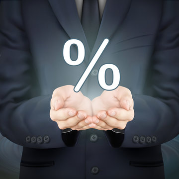 businessman holding percent icon