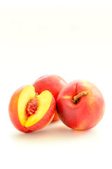 fresh peaches on white background