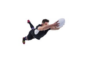 Rugby player scoring a try