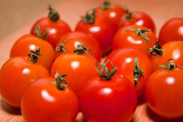 Red ripe tomatoes  on a wooden surface