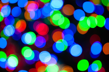 Christmas lights color bokeh - A bright multicolor bokeh background created by a set of de-focused Christmas lights.