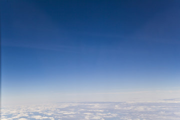 Naklejka na ściany i meble Blick aus einem Flugzeug mit Cummulus Wolken