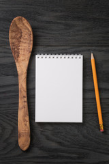 simple blank notepad on rustic wood table, background