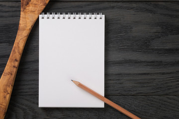 simple blank notepad on rustic wood table, background