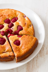 pie with berries on plate on white background
