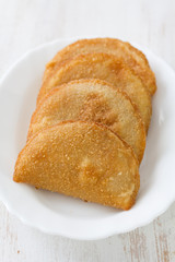 portuguese meat cookies on white dish on white background