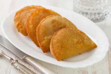 meat cookies on white dish on white background