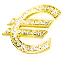 goldenes Eurozeichen mit Diamanten besetzt