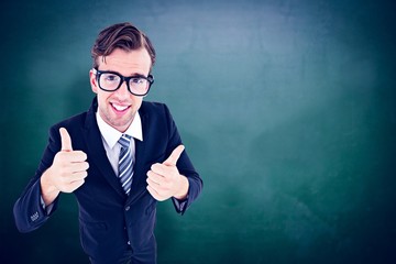 Composite image of geeky hipster smiling at camera 