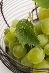 Bunch of white grapes in basket