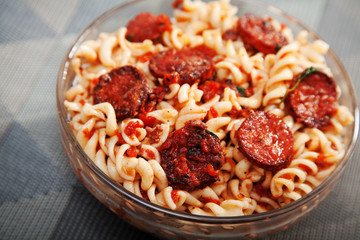 Fusilli with sausage, tomato sauce and parmesan