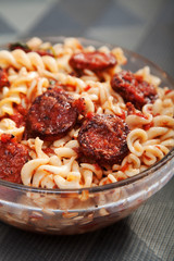 Fusilli with sausage, tomato sauce and parmesan