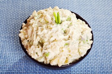 Patato and avocado mash garnished with mayonnaise