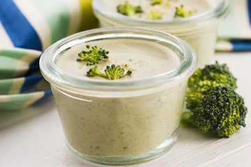 Broccoli cream soup on table