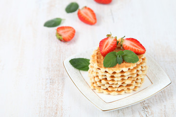 Waffles, mint and ripe strawberries