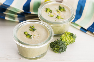 Broccoli cream soup on table