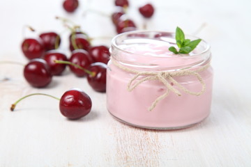 Obraz na płótnie Canvas Cherry yogurt and ripe cherry