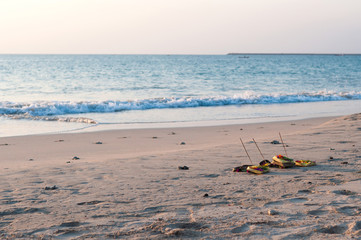 Fototapeta na wymiar Traditional balinese offerings to gods on the beach