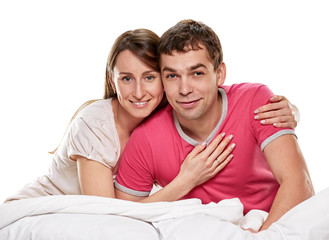 Fototapeta premium Couple lying in bed smiling