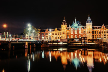 Fototapeta na wymiar Beautiful night in Amsterdam. Night illumination of buildings an