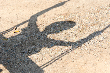Fototapeta na wymiar child shadow swinging