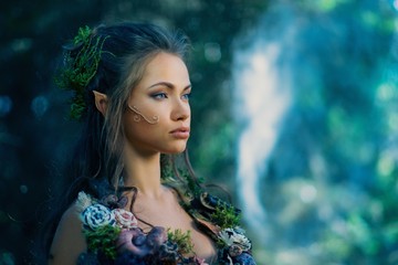 Elf woman in a magical forest - obrazy, fototapety, plakaty