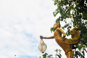 Golden Angel statue with morning sky