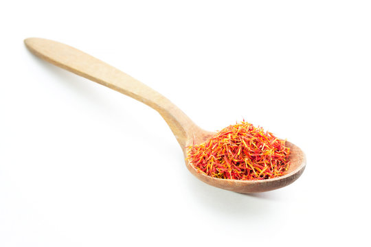 Aromatic saffron spice on wooden spoon. Isolated.
